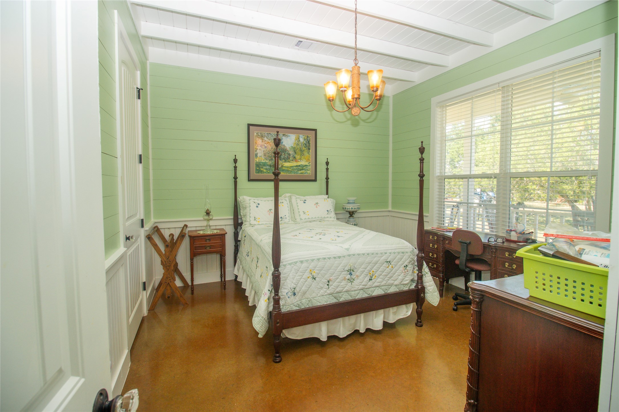 4237 County Road 330 Burnet, TX 78611 - Photo 18 of 40 a spacious bedroom with a bed a table and potted plant with the dresser