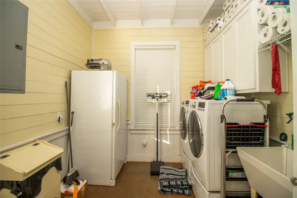 a living room with a couch and a floor to ceiling window