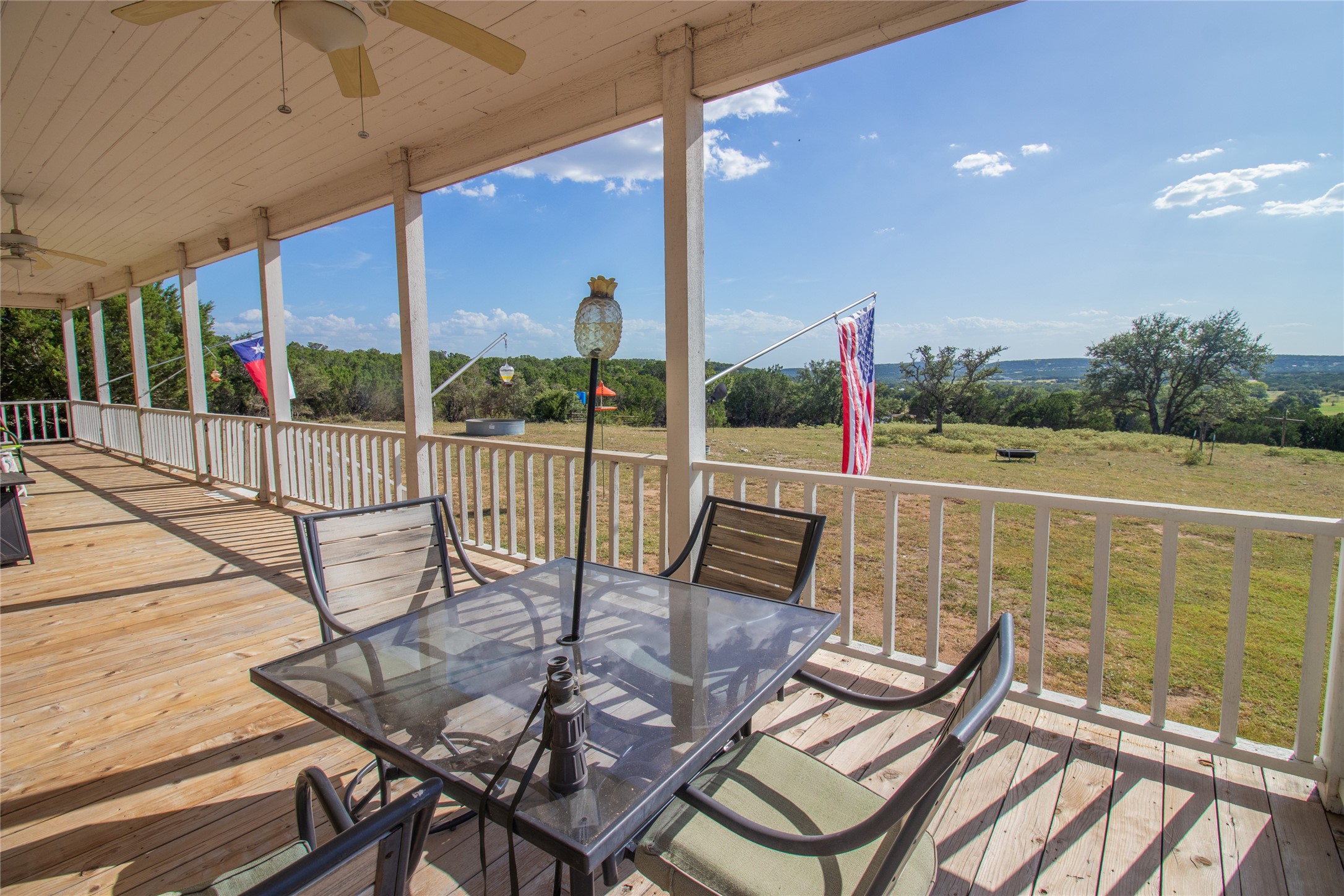 4237 County Road 330 Burnet, TX 78611 - Photo 31 of 40 a view of a chairs and table in patio with a lake view