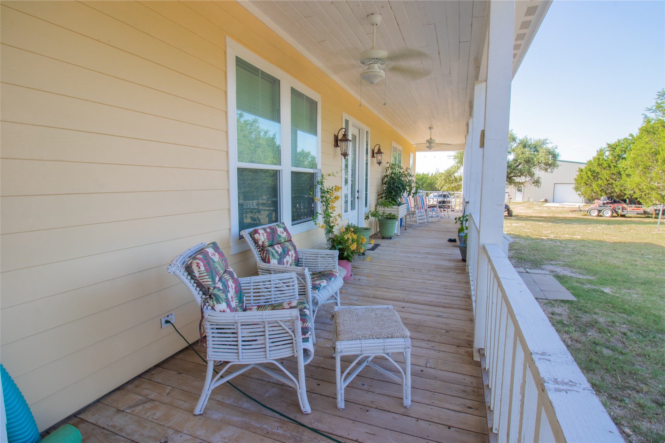 4237 County Road 330 Burnet, TX 78611 - Photo 32 of 40 a view of a patio with table and chairs with wooden floor and fence