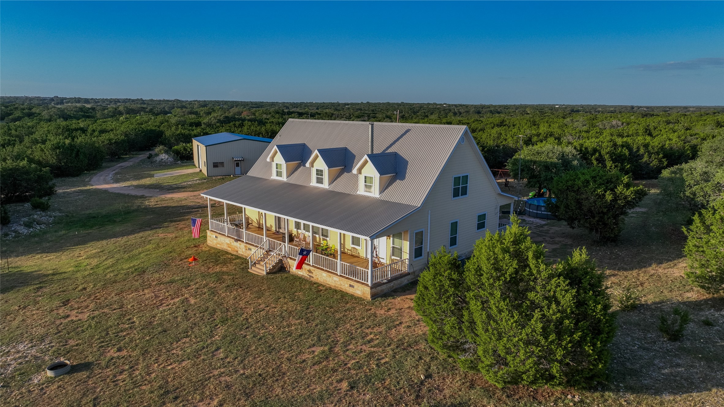 4237 County Road 330 Burnet, TX 78611 - Photo 35 of 40 Drone / aerial view of a heavily wooded area