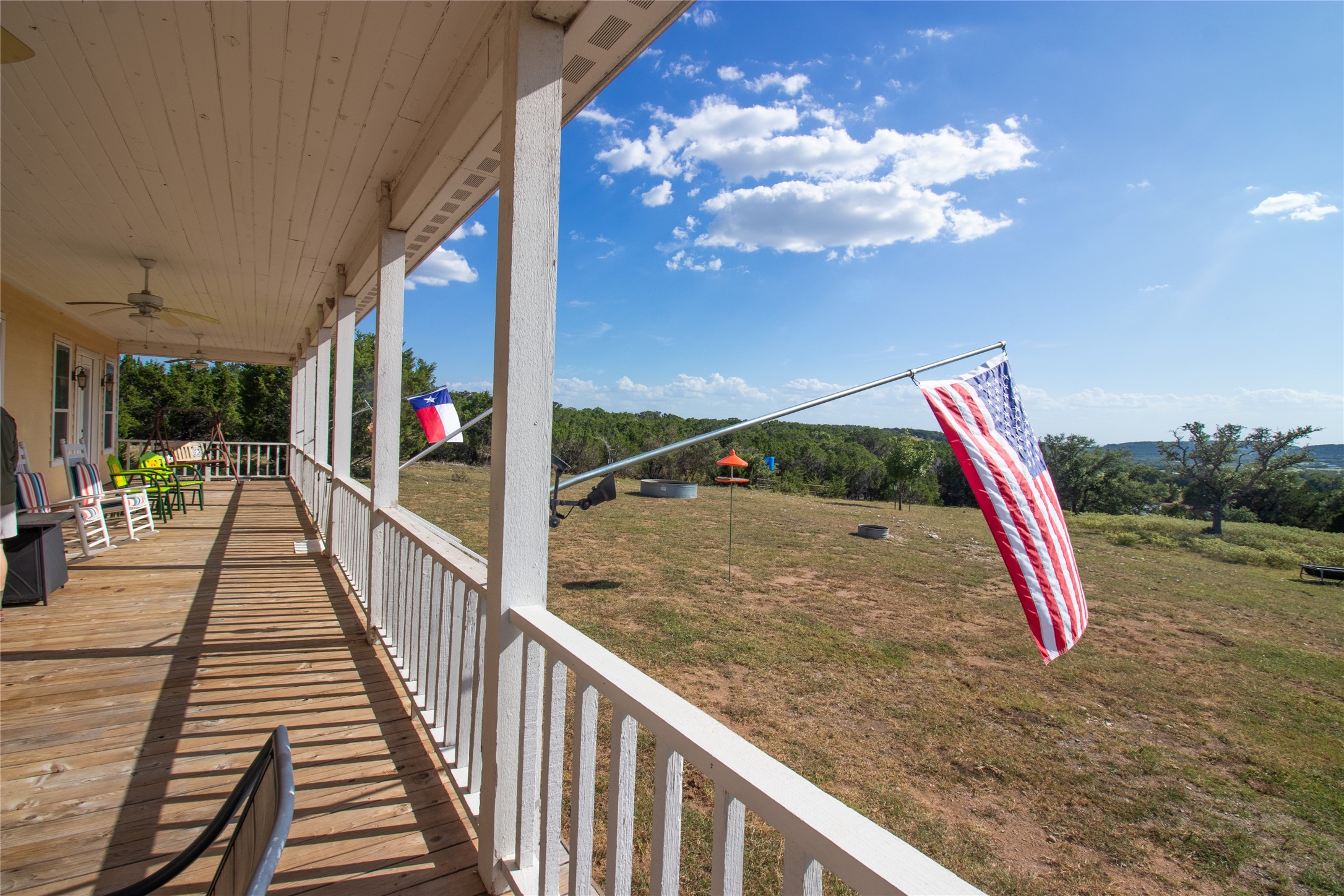4237 County Road 330 Burnet, TX 78611 - Photo 6 of 40 Porch with a ceiling fan and a lawn