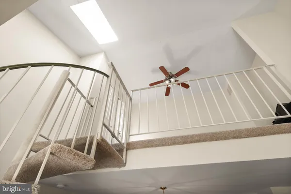 a view of staircase with white walls