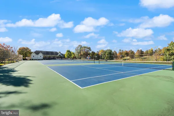 a view of an outdoor space and tennis court
