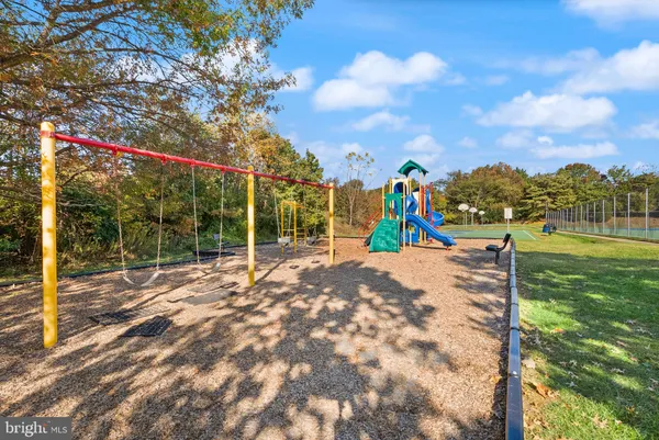 a view of a park with iron fence