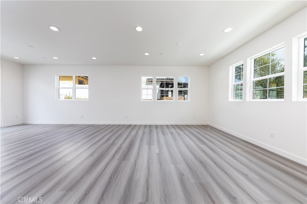 1371 Point Loma Place Walnut, CA 91789 - Photo 11 of 37 an empty room with wooden floor and windows