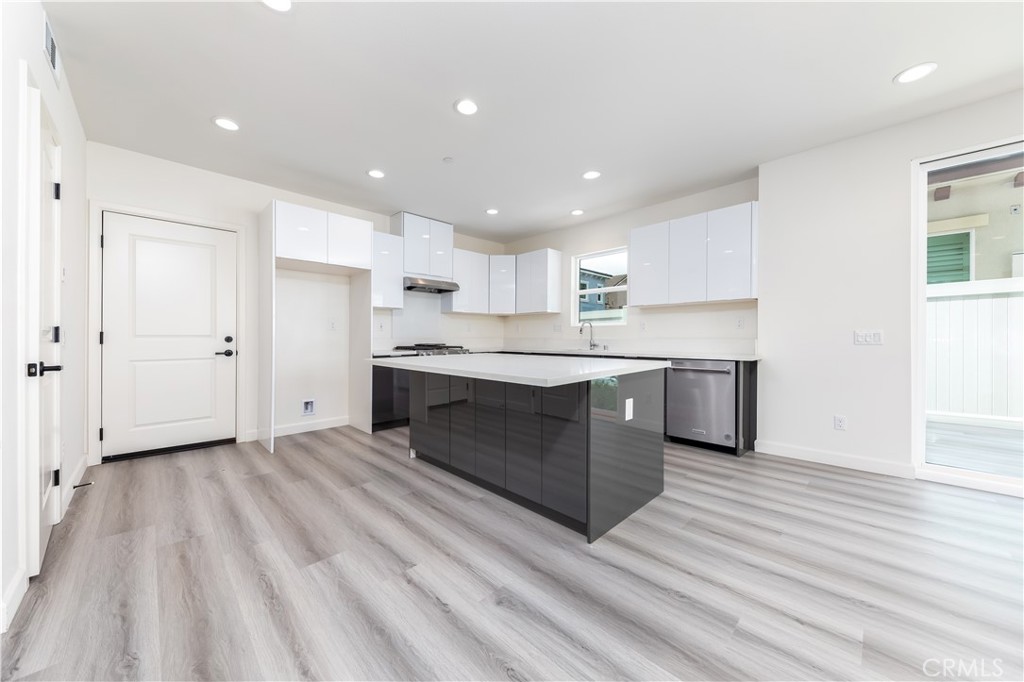 1371 Point Loma Place Walnut, CA 91789 - Photo 14 of 37 a large kitchen with stainless steel appliances granite countertop a stove a sink and a refrigerator
