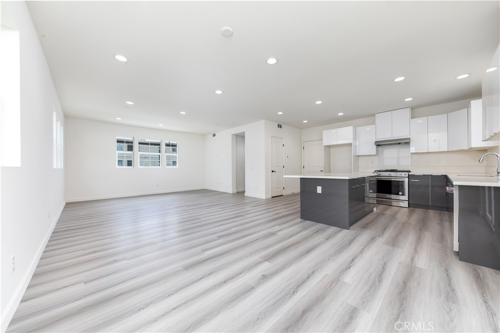 1371 Point Loma Place Walnut, CA 91789 - Photo 18 of 37 a open kitchen with kitchen island a sink dishwasher stove and oven