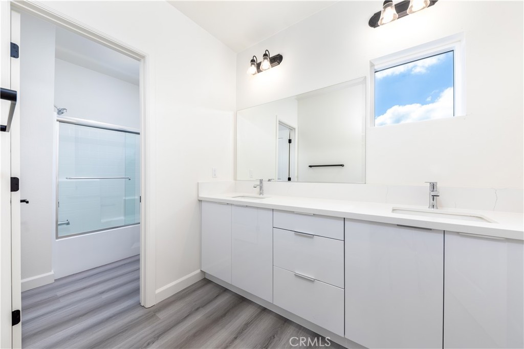 1371 Point Loma Place Walnut, CA 91789 - Photo 21 of 37 a bathroom with a double vanity sink and mirror