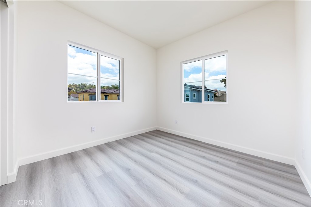 1371 Point Loma Place Walnut, CA 91789 - Photo 23 of 37 an empty room with wooden floor and windows