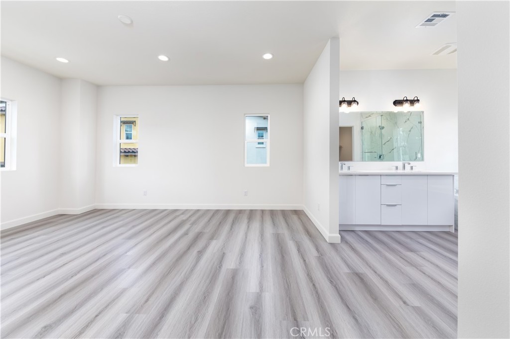 1371 Point Loma Place Walnut, CA 91789 - Photo 27 of 37 an empty room with wooden floor and windows
