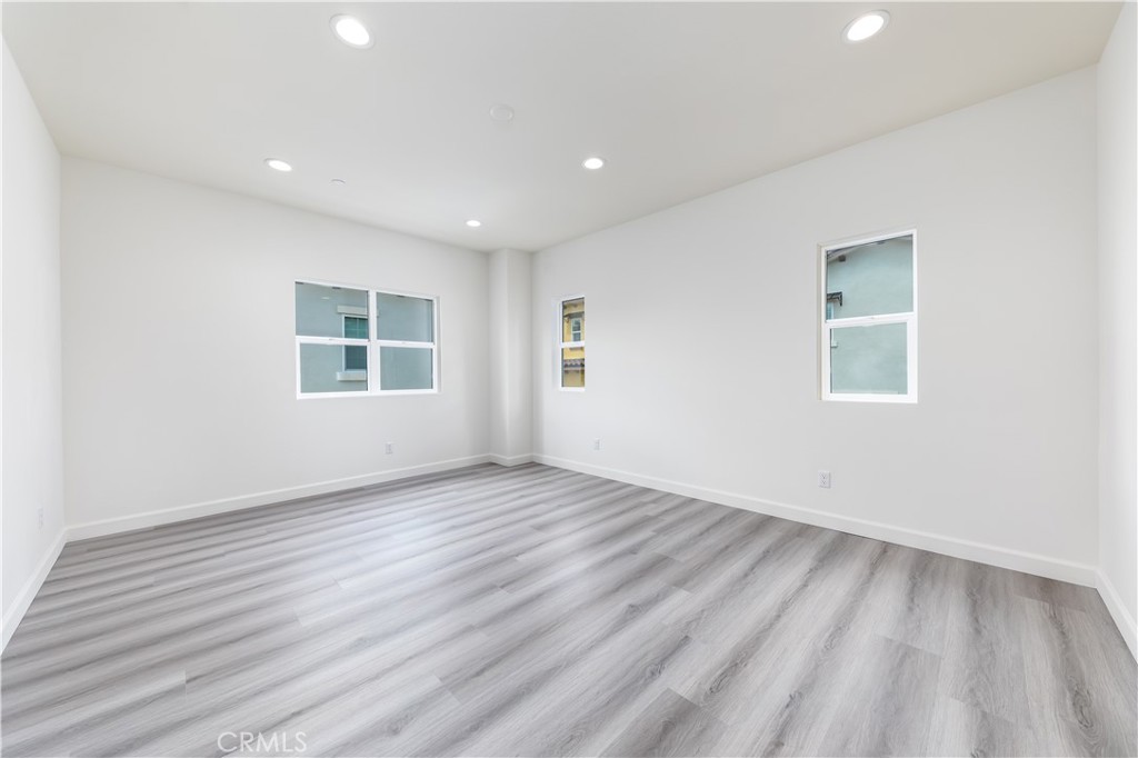 1371 Point Loma Place Walnut, CA 91789 - Photo 28 of 37 an empty room with wooden floor and windows