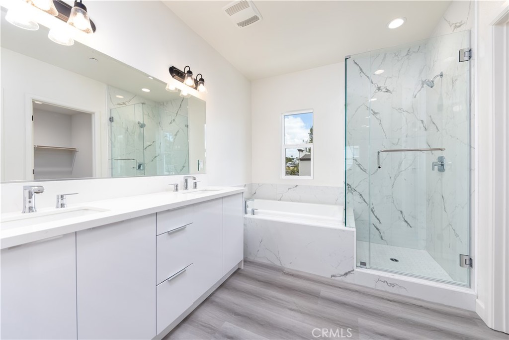 1371 Point Loma Place Walnut, CA 91789 - Photo 30 of 37 a bathroom with a double vanity sink mirror and shower