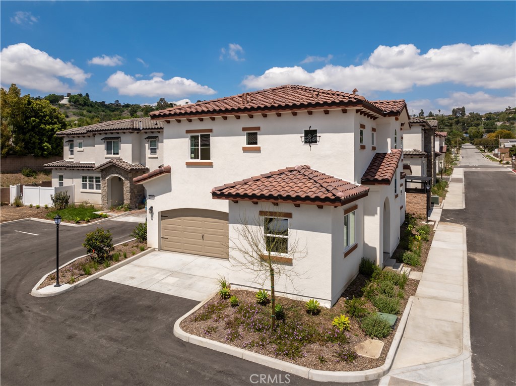 1371 Point Loma Place Walnut, CA 91789 - Photo 3 of 37 a aerial view of a house with a yard
