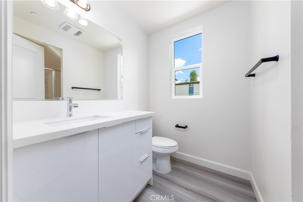 1371 Point Loma Place Walnut, CA 91789 - Photo 10 of 37 a bathroom with a sink toilet and a mirror