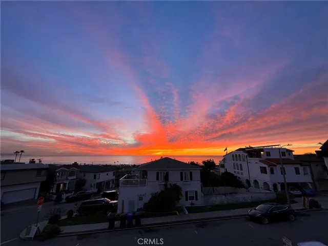 a view of multiple houses with a city street