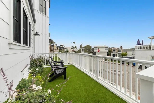 a balcony with an outdoor seating