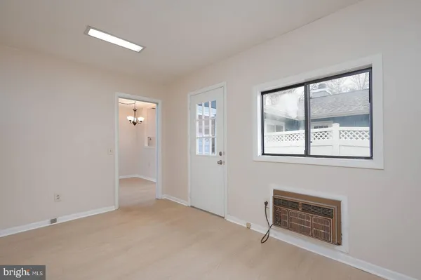 a view of an empty room with a window