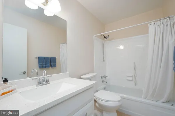 a kitchen with a sink and a stove top oven