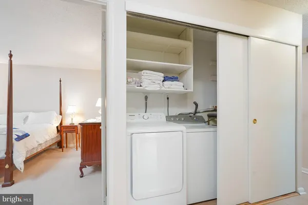 a bed room with a bed and a table