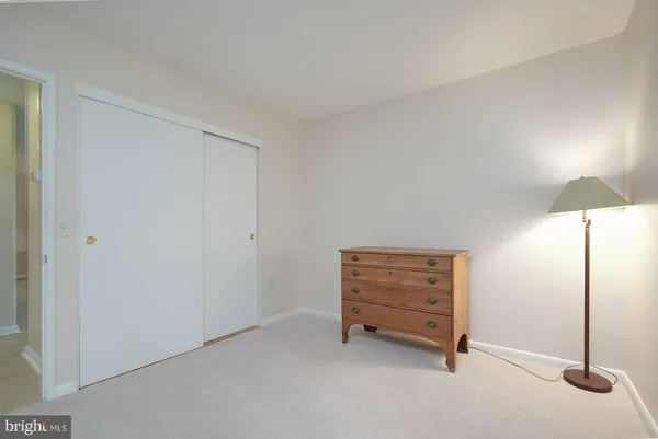 a view of a chairs and table in backyard of the house