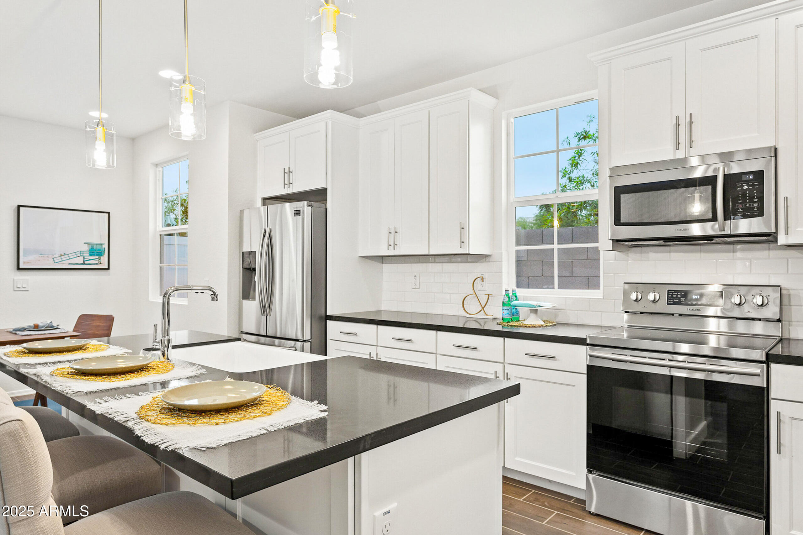 16875 North 12th Street, Unit 2 Phoenix, AZ 85022 - Photo 6 of 16 a kitchen with stainless steel appliances granite countertop a sink and a stove