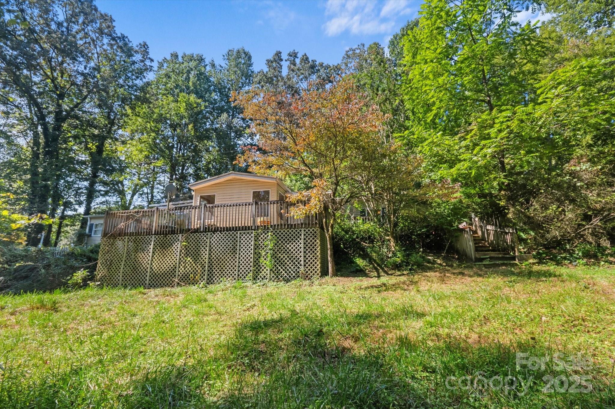 7 Maple Drive Brevard, NC 28712 - Photo 1 of 31 a view of a backyard
