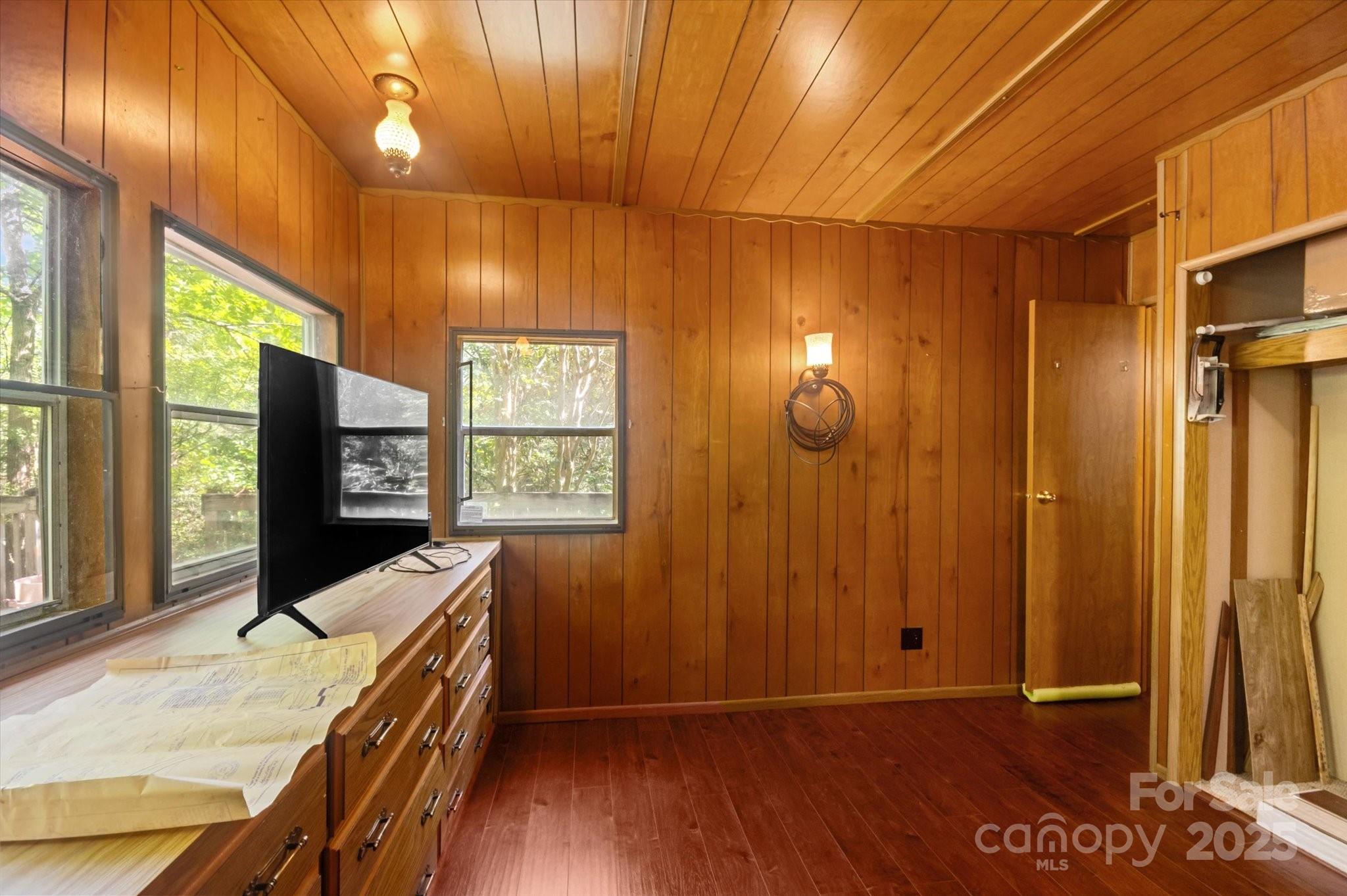 7 Maple Drive Brevard, NC 28712 - Photo 9 of 31 a view of a room with wooden floor and windows