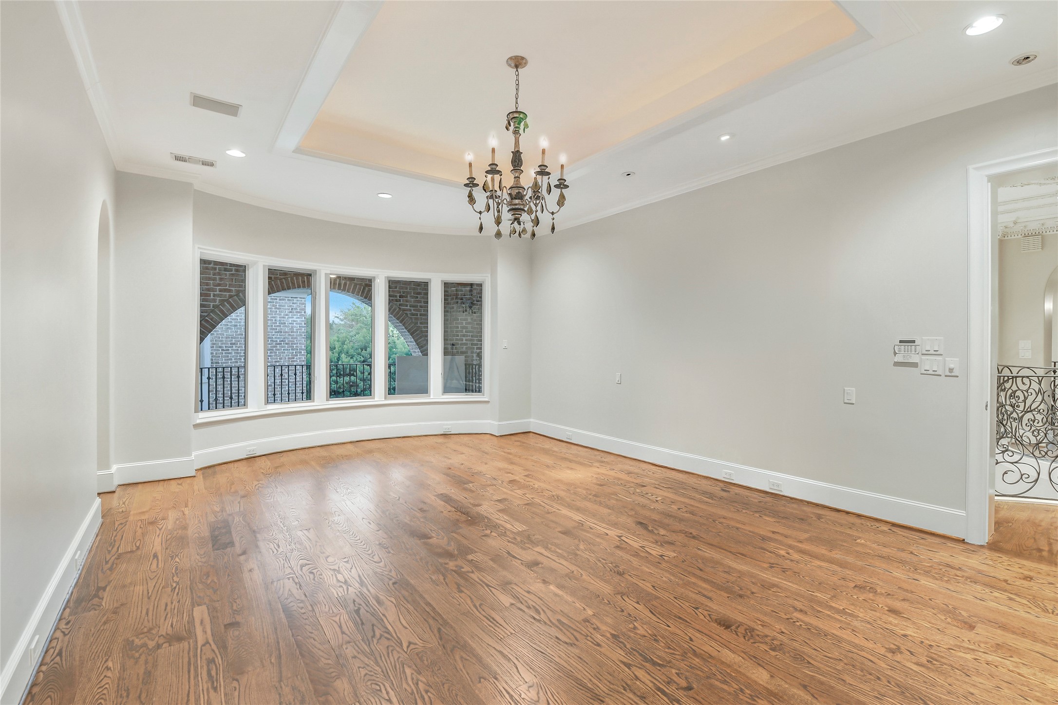 5626 Terwilliger Way Houston, TX 77056 - Photo 18 of 47 a view of an empty room with wooden floor and a window