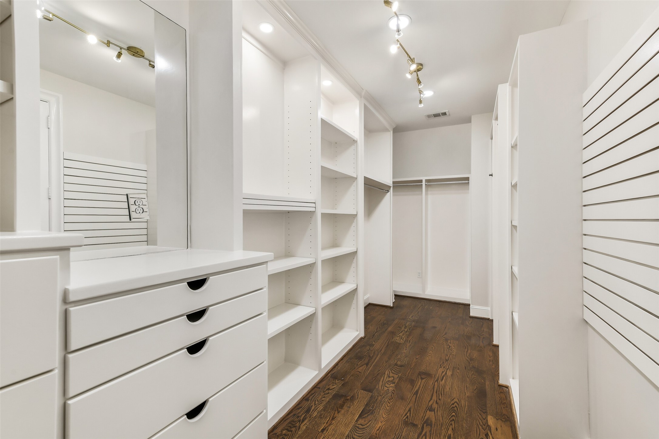 5626 Terwilliger Way Houston, TX 77056 - Photo 23 of 47 a view of walk in closet with empty racks