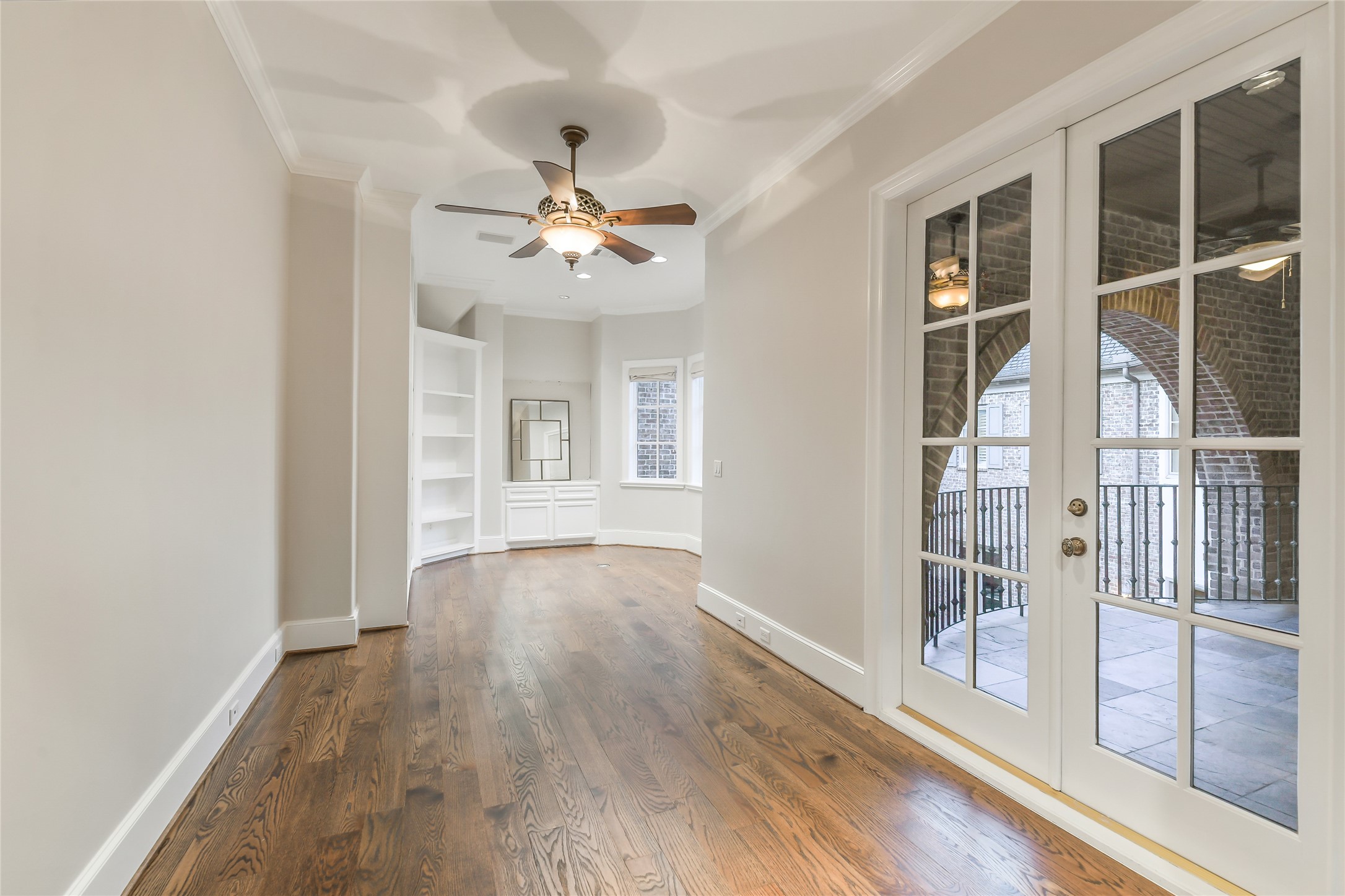 5626 Terwilliger Way Houston, TX 77056 - Photo 25 of 47 a view of an empty room with a window and wooden floor