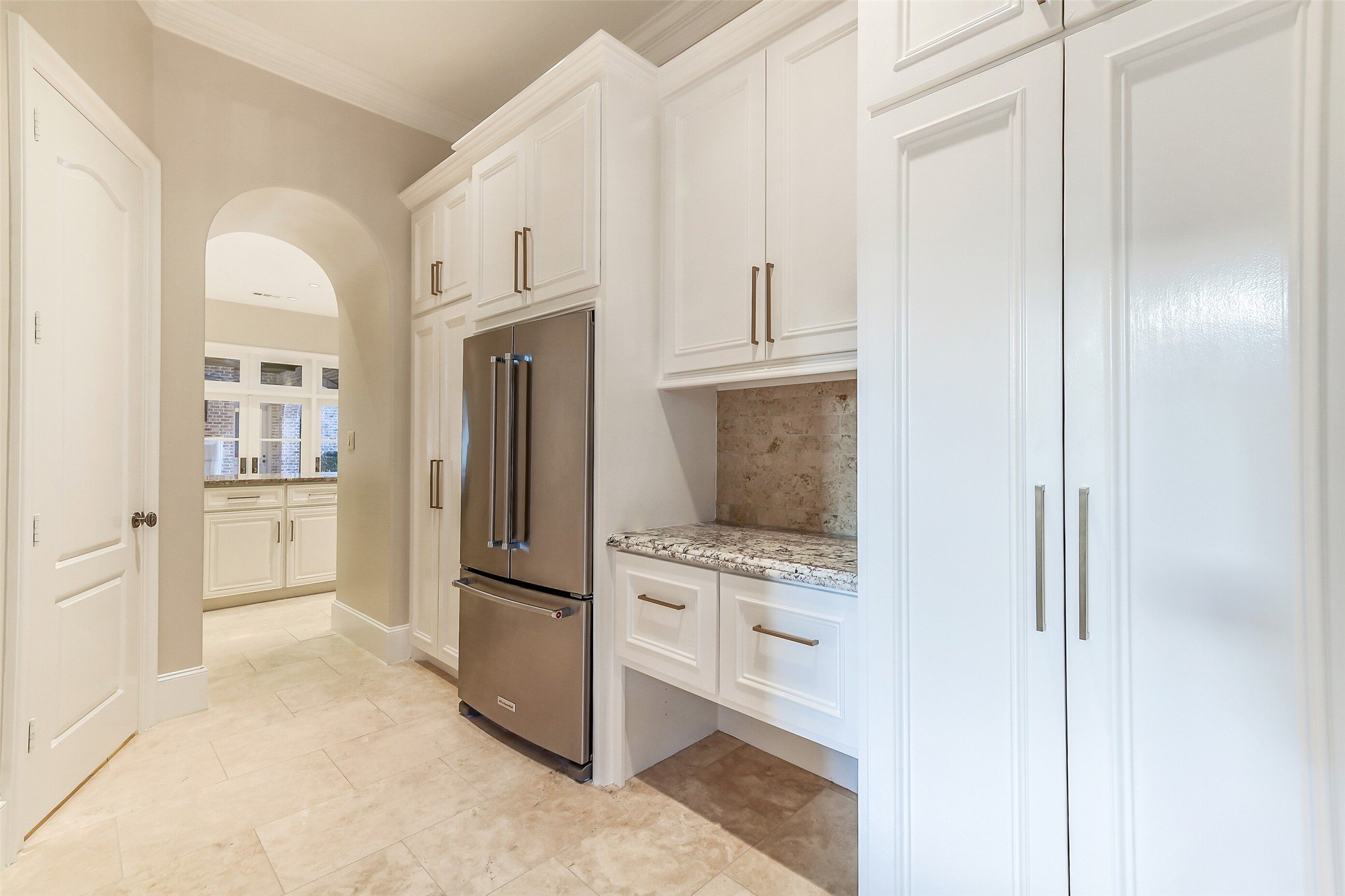 5626 Terwilliger Way Houston, TX 77056 - Photo 40 of 47 a kitchen with white cabinets and stainless steel appliances