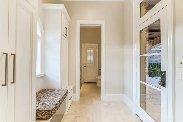 a view of an entryway with wooden floor