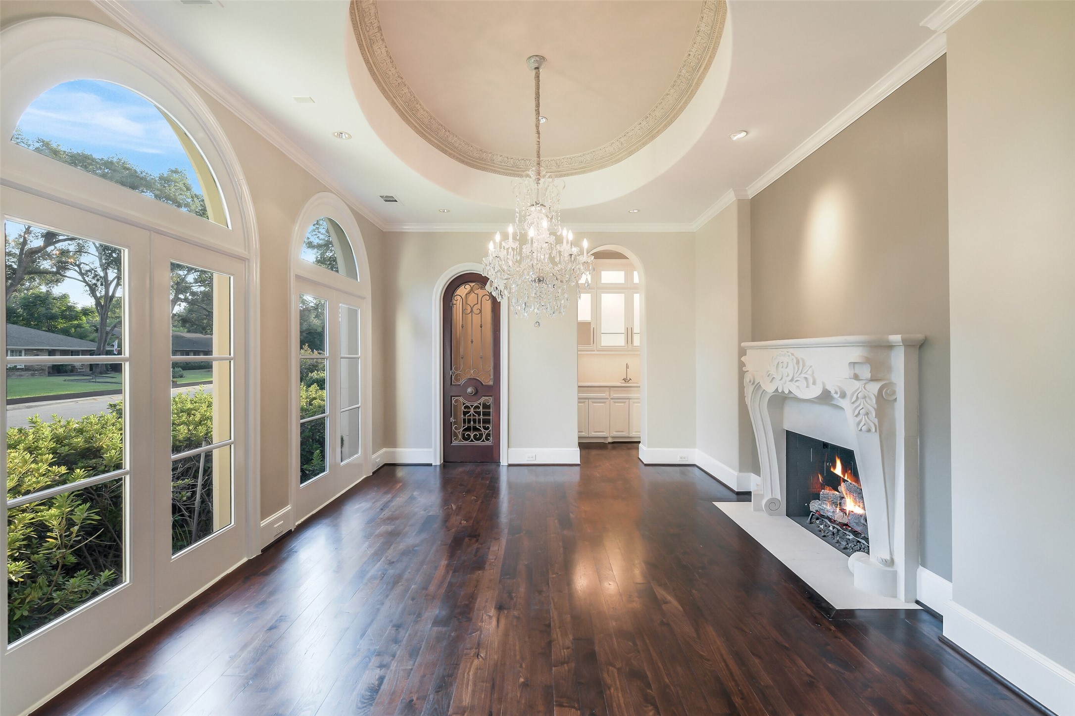 5626 Terwilliger Way Houston, TX 77056 - Photo 6 of 47 a view of an empty room with wooden floor fireplace and a window