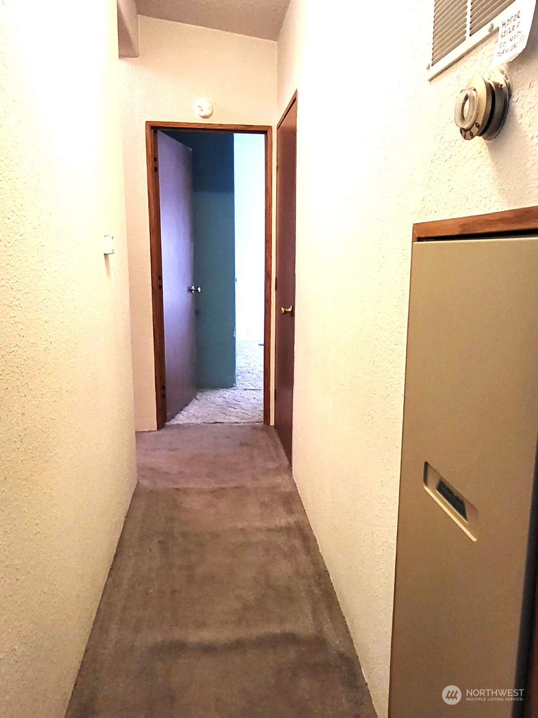 2285 Basin Street Southwest, Unit 11 Ephrata, WA 98823 - Photo 11 of 27 a view of a hallway with wooden floor