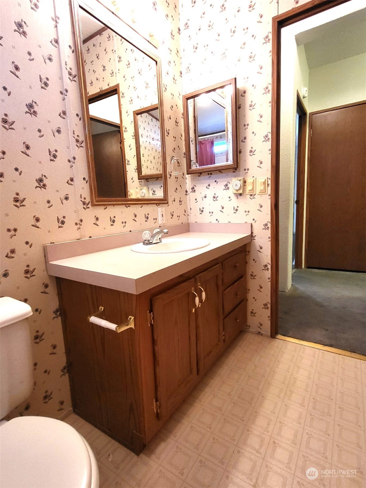 2285 Basin Street Southwest, Unit 11 Ephrata, WA 98823 - Photo 23 of 27 a bathroom with a sink vanity mirror and toilet