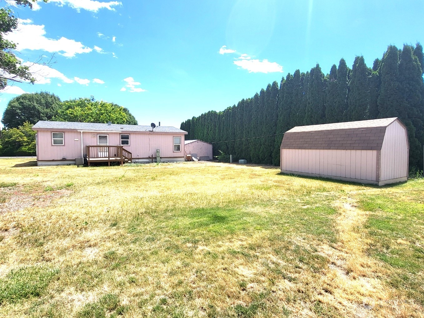 2285 Basin Street Southwest, Unit 11 Ephrata, WA 98823 - Photo 26 of 27 a view of a swimming pool with an outdoor space and seating area