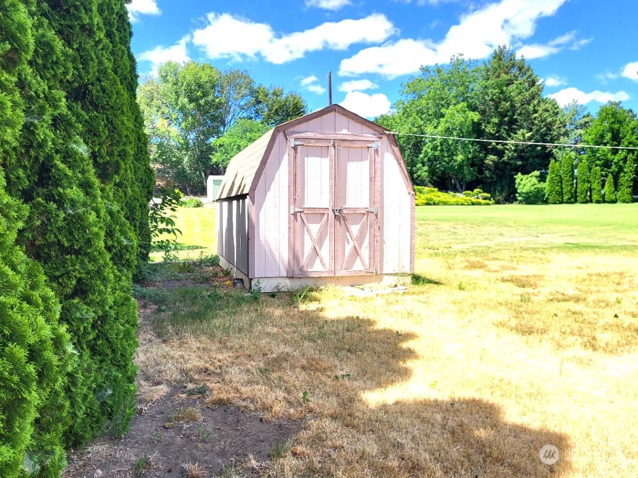 2285 Basin Street Southwest, Unit 11 Ephrata, WA 98823 - Photo 27 of 27 a view of a tiny house with backyard