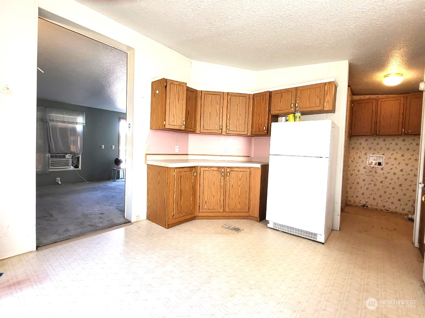 2285 Basin Street Southwest, Unit 11 Ephrata, WA 98823 - Photo 7 of 27 a kitchen with a refrigerator and a refrigerator