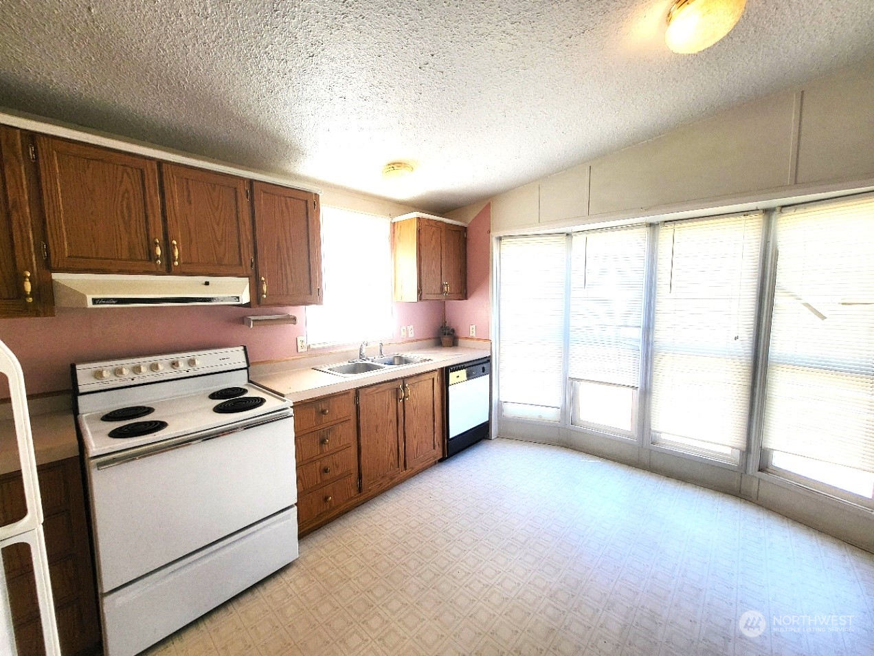 2285 Basin Street Southwest, Unit 11 Ephrata, WA 98823 - Photo 8 of 27 a kitchen with a stove a sink and a window