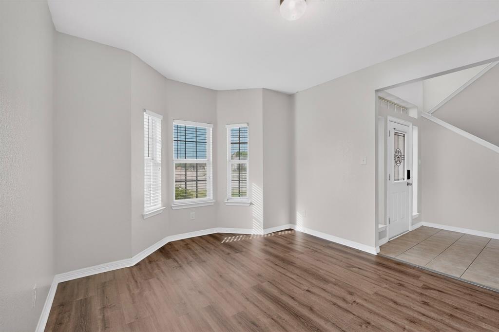 3401 Newgate Street Midlothian, TX 76065 - Photo 3 of 34 Spacious room featuring wood-finish flooring and a bay window with white blinds