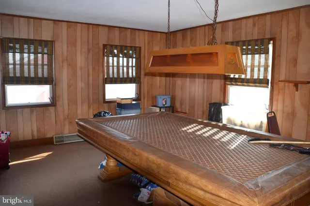a bed sitting in a room next to a window