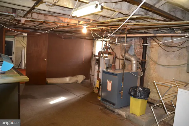 a utility room with a window and a sink