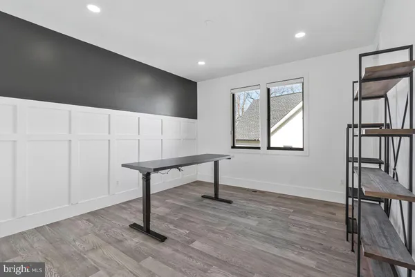 a view of a room with wooden floor