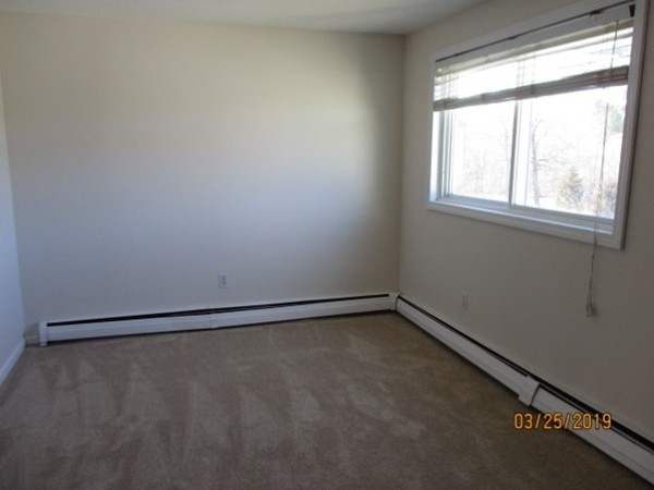 172 Ayer Road, Unit D Shirley, MA 01464 - Photo 6 of 10 a view of a room with window
