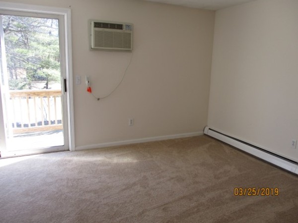 172 Ayer Road, Unit D Shirley, MA 01464 - Photo 7 of 10 a view of an empty room with a window