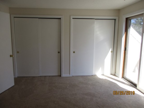 172 Ayer Road, Unit D Shirley, MA 01464 - Photo 8 of 10 a view of empty room with window