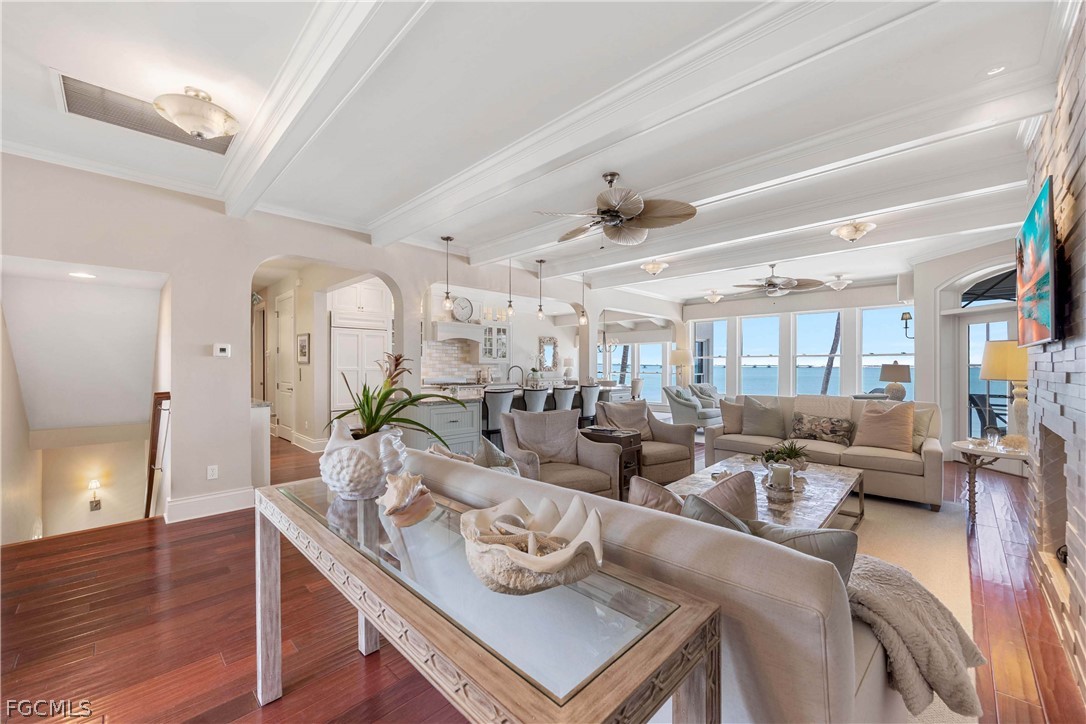528 Lighthouse Way Sanibel, FL 33957 - Photo 16 of 49 a living room with lots of furniture and wooden floor