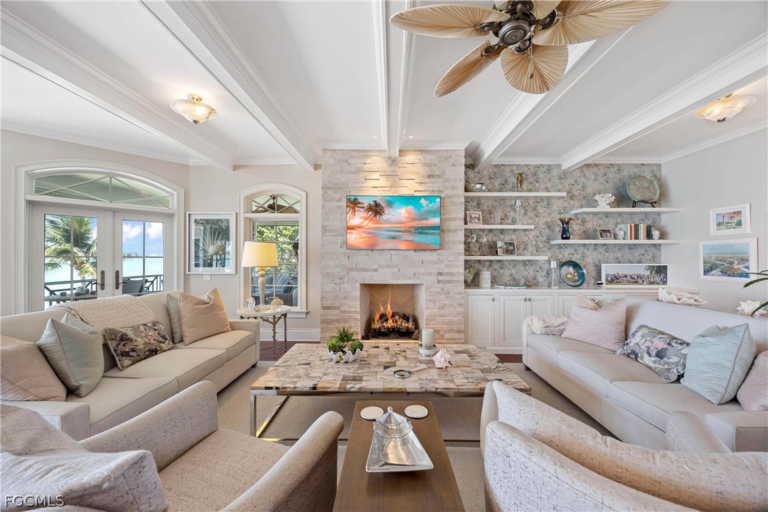 528 Lighthouse Way Sanibel, FL 33957 - Photo 17 of 49 a living room with furniture and a fireplace
