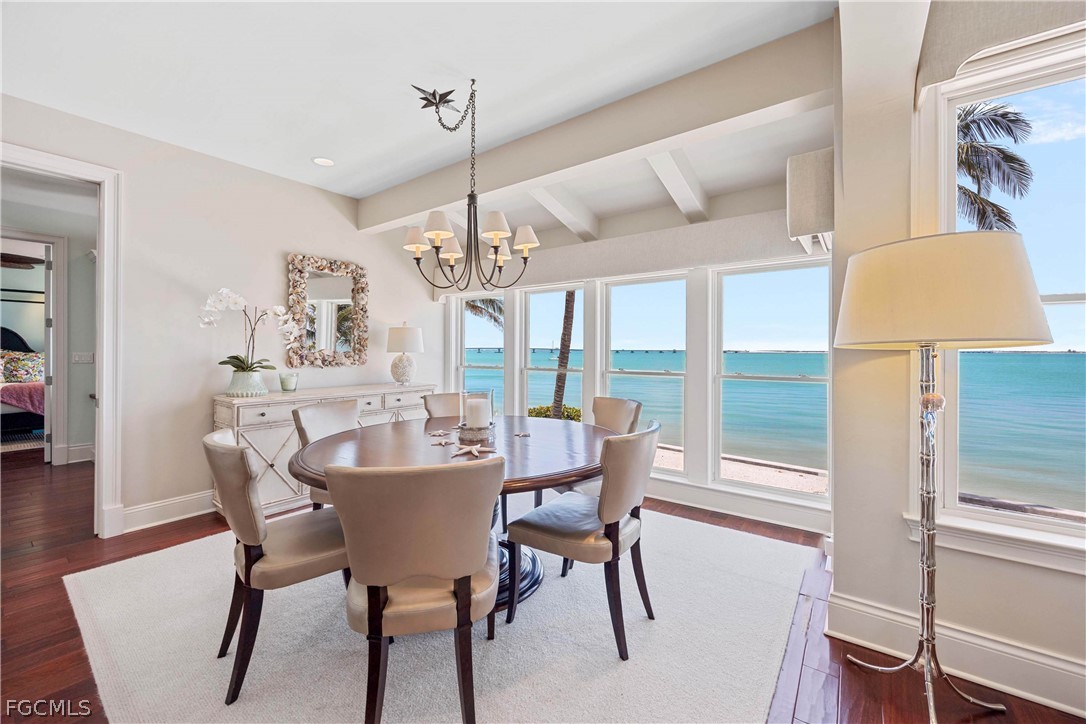 528 Lighthouse Way Sanibel, FL 33957 - Photo 19 of 49 a view of a dining room with furniture window and wooden floor
